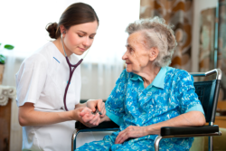 elderly woman with her nurse